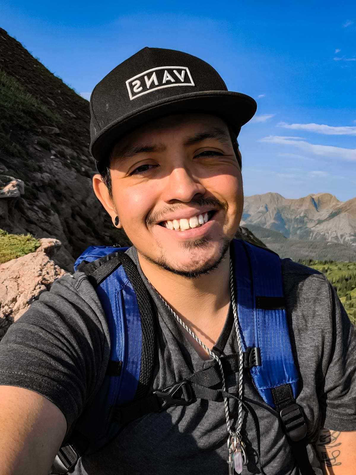 Photo of Jacob Candelaria in the mountains in Colorado.